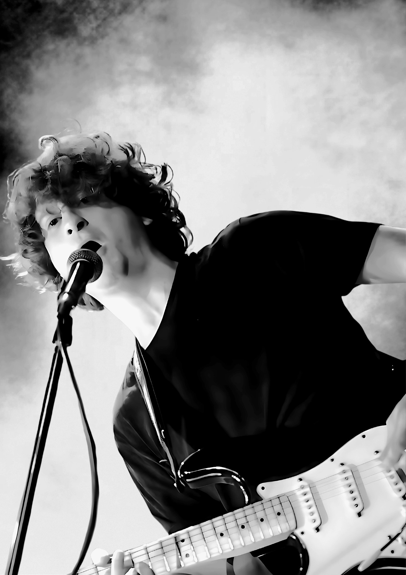 Papa Shandy & the Bandits live — frontman at the mic with a guitar, stage light behind.